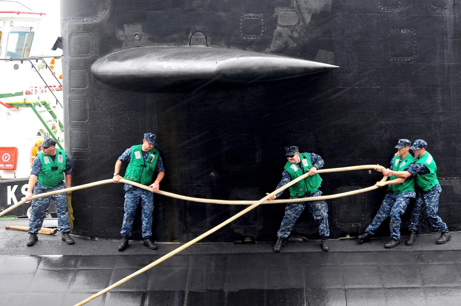 Sailors secure the Los Angeles class attack submarine USS Dallas in Diego Garcia